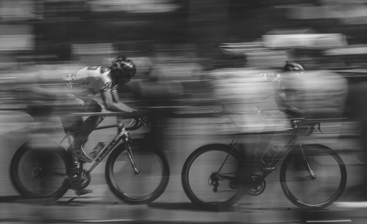 Black and White photo blur on 2 cyclists.
